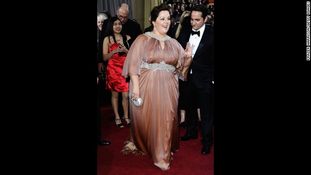 We love Melissa McCarthy so much that we've pre-emptively pledged to see each and every one of her movies, including the poorly reviewed ones. That is why it pained us to see her wear this awkward dress to the 2012 Oscars.