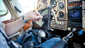 Thomas uses his prosthetic arm and hook to control the plane\'s engine and instruments.