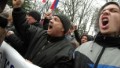 Pro-russian demonstrators shout slogans as they demonstrate in front of the Crimean parliament building in Simferopol on February 27, 2014. Ukraine's ousted pro-Moscow president Viktor Yanukovych emerged defiant on February 27 from five days in hiding as the country's new leaders issued a blunt warning to Russia against any aggression on the volatile Crimean peninsula. Anxious Western governments voiced fears about the 