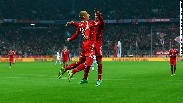 Arjen Robben (left) celebrates team mate Thiago during the 5-1 win over Schalke on Saturday. 