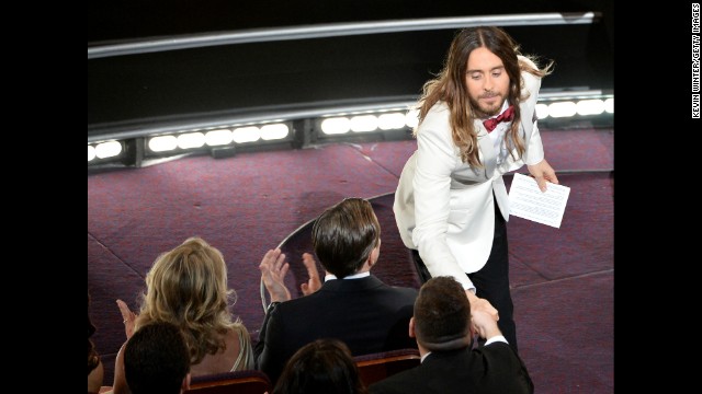 Jared Leto shakes hands with an audience member after winning the best supporting actor Oscar for his role in "Dallas Buyers Club."