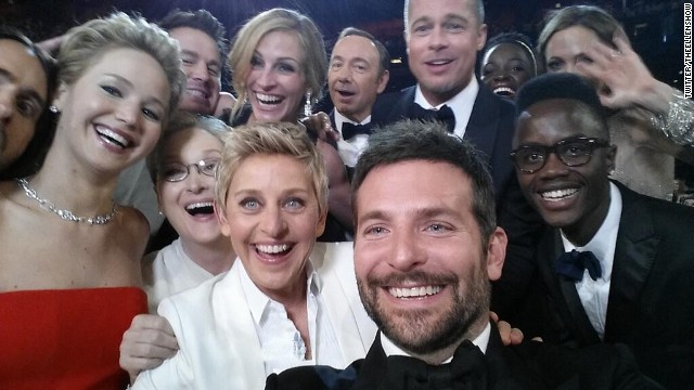 DeGeneres takes a moment during the show to orchestrate a selfie with a group of stars. Bradley Cooper, seen in the foreground, was holding the phone at the time. "If only Bradley's arm was longer," <a href='https://twitter.com/TheEllenShow/status/440322224407314432' >DeGeneres tweeted</a>. "Best photo ever." It reportedly became the most retweeted post of all time.