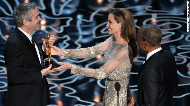 Angelina Jolie and Sidney Poitier present Alfonso Cuaron with the best director Oscar for "Gravity."