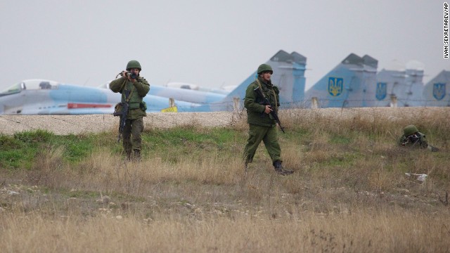 Russian soldiers aim a grenade launcher and machine gun as they guard positions at the Belbek air base on March 4.