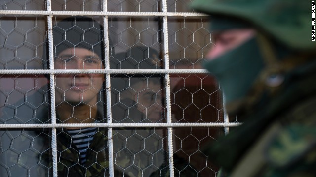 A sailor looks out a window near the entrance to the Ukrainian navy headquarters in Sevastopol on March 3.