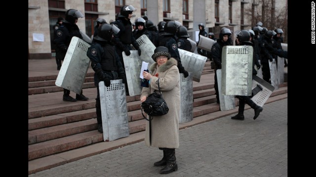 Riot police stand at the entrance of a regional administrative building during a rally in Donetsk on March 5.