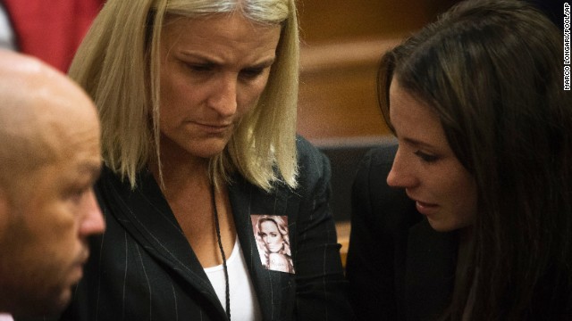 Pistorius' sister, Aimee, right, speaks with members of Steenkamp's family on March 6.