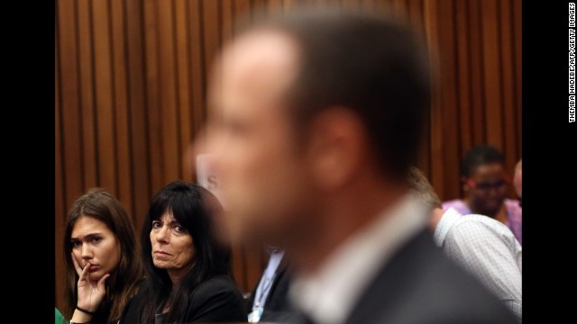 Friends of Steenkamp's family watch Pistorius during his trial on March 7.