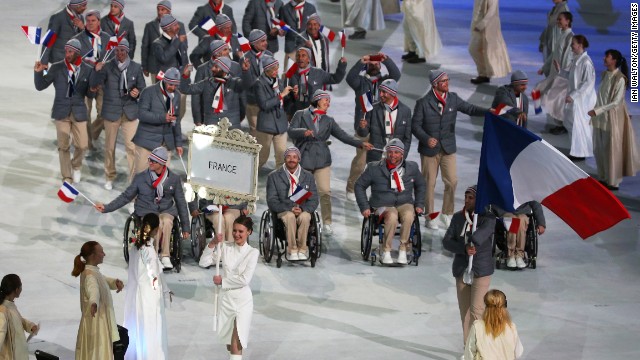 France enters the stadium led by skier and flag bearer Vincent Gauthier-Manuel.