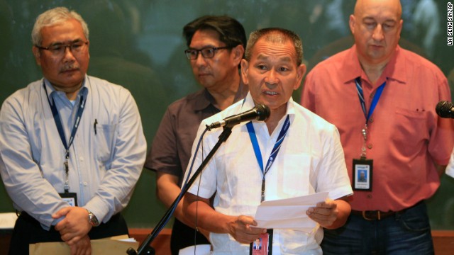 Malaysia Airlines Group CEO Ahmad Juahari Yahya, front, speaks during a news conference on March 8 at a hotel in Sepang. "We deeply regret that we have lost all contacts" with the jet, he said.