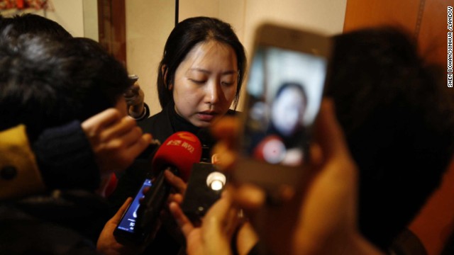 Wang Yue, director of marketing of Malaysia Airlines in China, reads a company statement during a news conference at the Metro Park Lido Hotel in Beijing on March 8. 