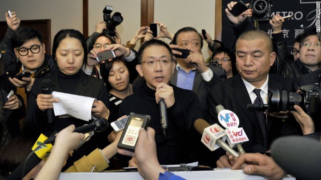 Malaysia Airlines official Joshua Law Kok Hwa, center, speaks to reporters in Beijing on March 8.