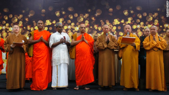 Buddhist monks at Kuala Lumpur International Airport offer a special prayer for the missing passengers on March 9.