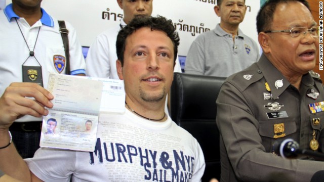 Italian tourist Luigi Maraldi, who reported his passport stolen in August, shows his current passport during a news conference at a police station in Phuket island, Thailand, on March 9. Two passengers on the missing Malaysia Airlines flight were reportedly traveling on stolen passports belonging to Maraldi and an Austrian citizen whose papers were stolen two years ago.