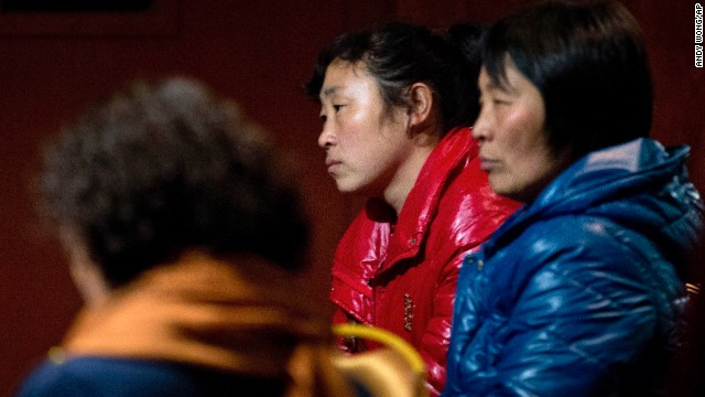 Relatives of the missing flight's passengers wait in a Beijing hotel room on March 10.