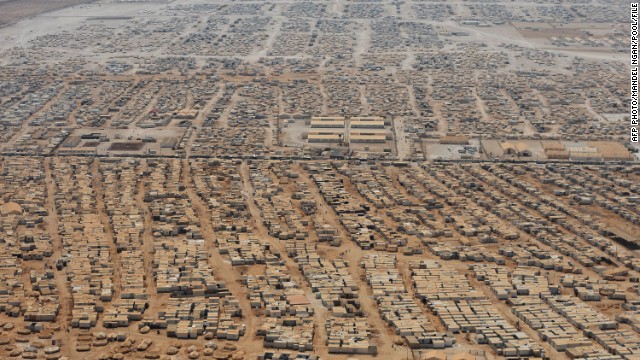 This is an aerial photograph of the Zaatari refugee camp, situated eight kilometers from the Jordan/Syria border, taken on July 18, 2013. As many as 150,000 people are now living there, with more arriving every day.<!-- -->
</br>