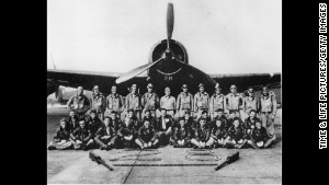 Members of the Navy pose in front of one of the Flight 19 planes that disappeared in 1945.