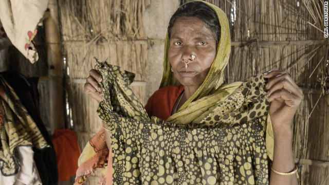 Jaida's mother, Saleha, believes her daughter was kidnapped by a trafficker who sold her into a forced marriage or prostitution. Saleha holds a dress Jaida left behind. The problem of missing women runs rampant in villages in western India. 