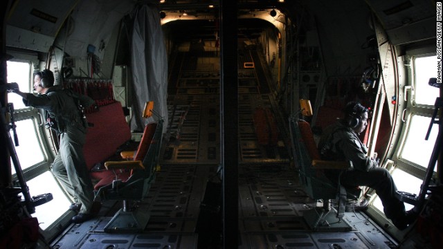 Malaysian air force members look for debris on March 13 near Kuala Lumpur.