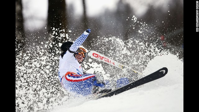 Aleksandr Akhmadulin of Russia crashes in the men's slalom on March 13.