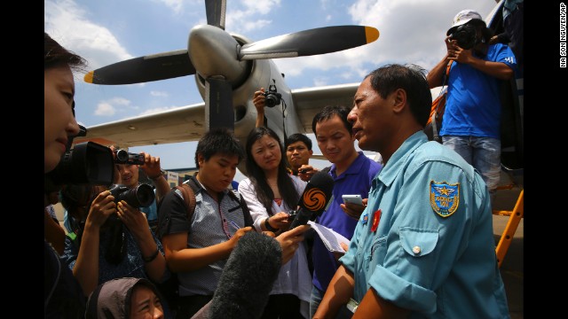 Col. Vu Duc Long of the Vietnam air force fields reporters' questions at an air base in Ho Chi Minh City, Vietnam, after a search operation on Friday, March 14.