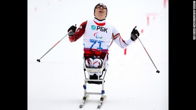 Kozo Kubo of Japan crosses the finish line in the men's biathlon on March 14.