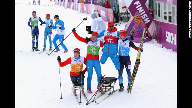 Grigory Murygin, left, Vladislav Lekomtcev, Roman Petushkov and Rushan Minnegulov of Russia celebrate after winning the 4 x 2.5-kilometer open relay cross-country skiing event on March 15.