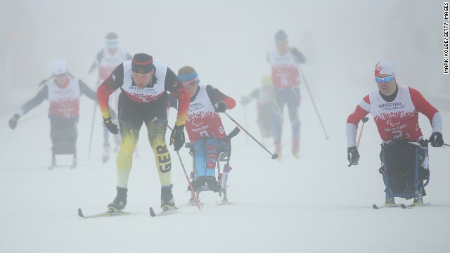 Tino Uhlig of Germany leads the field at the start of the 4 x 2.5-kilometer mixed relay cross-country on day eight of the Sochi 2014 Paralympic Winter Games.