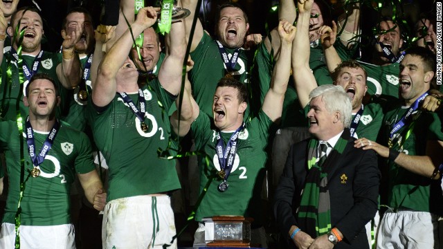 Brian O'Driscoll (front center) celebrates Ireland's Six Nations Champion ship success after winning at the Stade de France.