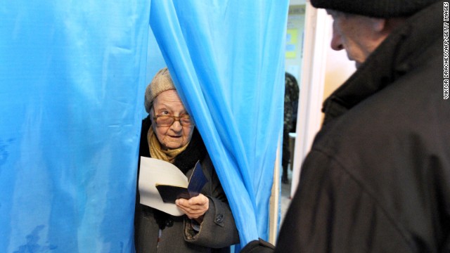 A woman leaves a voting booth in Sevastopol, Ukraine, on Sunday, March 16. Polls opened Sunday morning in a referendum in Ukraine's Crimea region, in which voters are to voice their wish to either join Russia or become an effectively independent state connected to Ukraine.