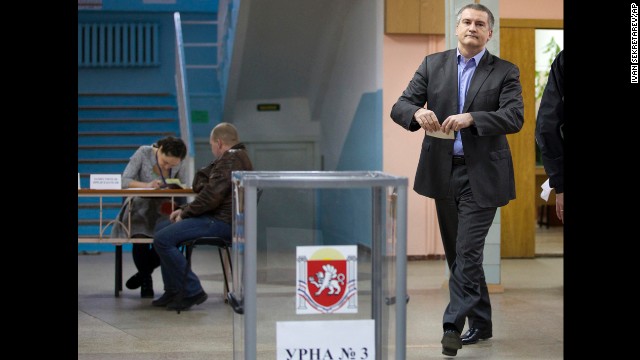 The newly installed pro-Russian leader of Crimea, Sergey Aksyonov, casts his ballot at a polling station. He called on the residents of Crimea to cast their votes "independent of nationalism and disintegration."