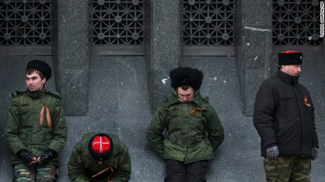 Cossacks guard the regional parliament building during the Crimean referendum in Simferopol. 