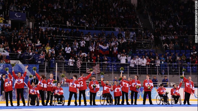 Canadian players react during the medal ceremony after the ice sledge hockey gold medal game between the Russian Federation and the United States on Saturday, March 15. The United States won, 1-0.