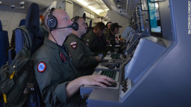 U.S. Navy crew members on board a P-8A Poseidon aircraft assist in search and rescue operations for Malaysia Airlines Flight 370 in the Indian Ocean on Sunday, March 16. The Boeing 777 went missing during March 8 flight from Kuala Lumpur to Beijing as it entered Vietnamese airspace.