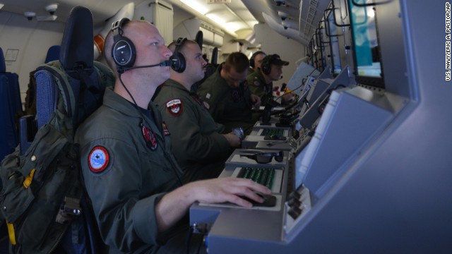 U.S. Navy crew members assist in search-and-rescue operations Sunday, March 16, in the Indian Ocean.