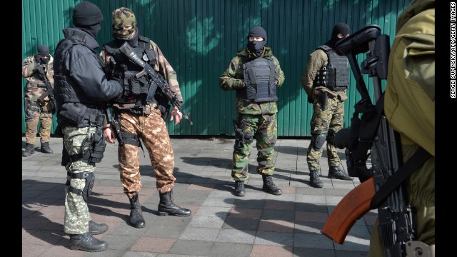 Ukrainian troops stand guard in front of the Ukrainian Parliament building in Kiev on March 17.