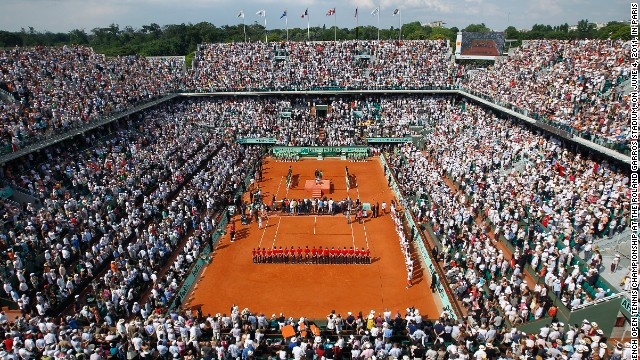 Stade Roland Garros was built in 1928 to host France's maiden defense of the Davis Cup following the quartet's 1927 win. Each of the stadium's four main grandstands are named after one of them, while the winner of the French Open men's singles championship is presented with the "Coupe des Mousquetaires" trophy.