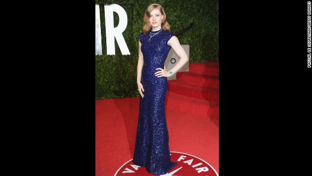 Actress Amy Adams arrives at the 2011 Vanity Fair Oscars party in a blue dress designed by Scott.