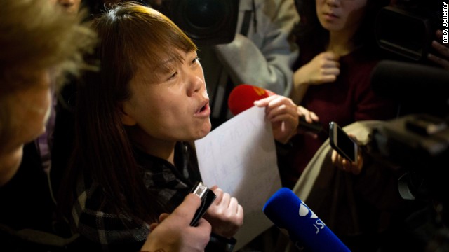 A relative of a missing passenger tells reporters in Beijing about a hunger strike to protest authorities' handling of information about the missing jet.