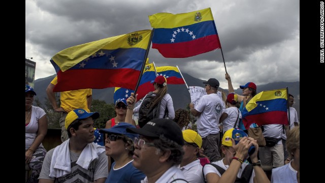 People take part in a protest against President Nicolas Maduro in Caracas on Sunday, March 16. 