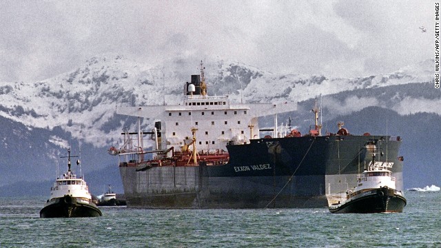 Tugboats tow the Exxon Valdez off Bligh Reef to a harbor for repair and salvage efforts, two weeks after the beginning of the oil disaster. The tanker changed names and owners several times, and was bought in 2012 by an Indian company, which scraps ships for steel and spare parts.