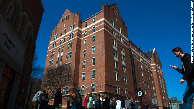 Students on Thursday stand outside McCarthy Hall, a Georgetown University dormitory where a student said he made ricin.