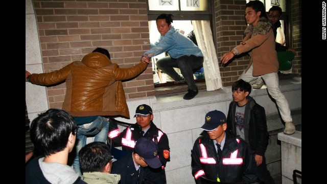 Protesters storm the government buildings in Taipei on March 24.