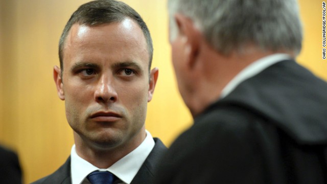 Pistorius talks to defense attorney Barry Roux on March 24. 