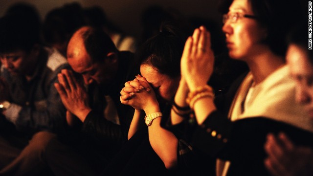 Relatives of the missing passengers hold a candlelight vigil in Beijing on March 24.