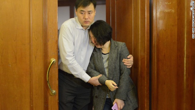 Grieving relatives of missing passengers leave a hotel in Beijing on March 24.