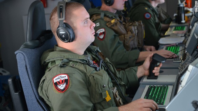 A U.S. airman monitors his instruments aboard a P-8 Poseidon during a mission in the southern Indian Ocean on March 23.