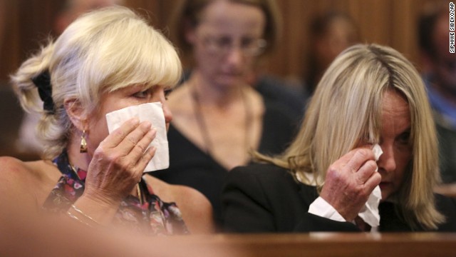 Steenkamp's mother, right, and family friend Jenny Strydom react in court Tuesday, March 25, during cross-questioning.