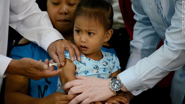 A child receives a measles vaccine in Manila, Philippines on January 21, 2014 following an upsurge in the virus.