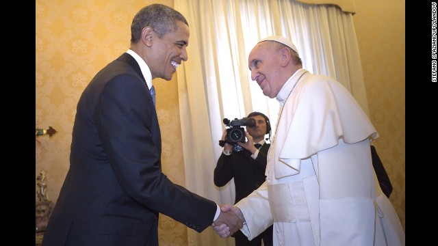 The two world leaders greeted each other with a smile and a handshake, and they posed for pictures before sitting down across a table from each other.